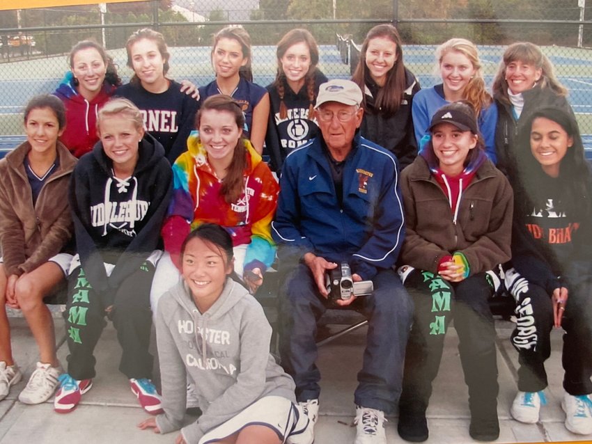 The late Eddie Anelundi sits with one of his Barrington High School tennis teams. Mr. Anelundi, who led Barrington to three state titles, passed away in late January.