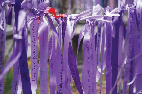 St. Michael&rsquo;s volunteers staged a demonstration of what the purple ribbon project will look like, once it begins on the first day of Lent, Feb. 17.
