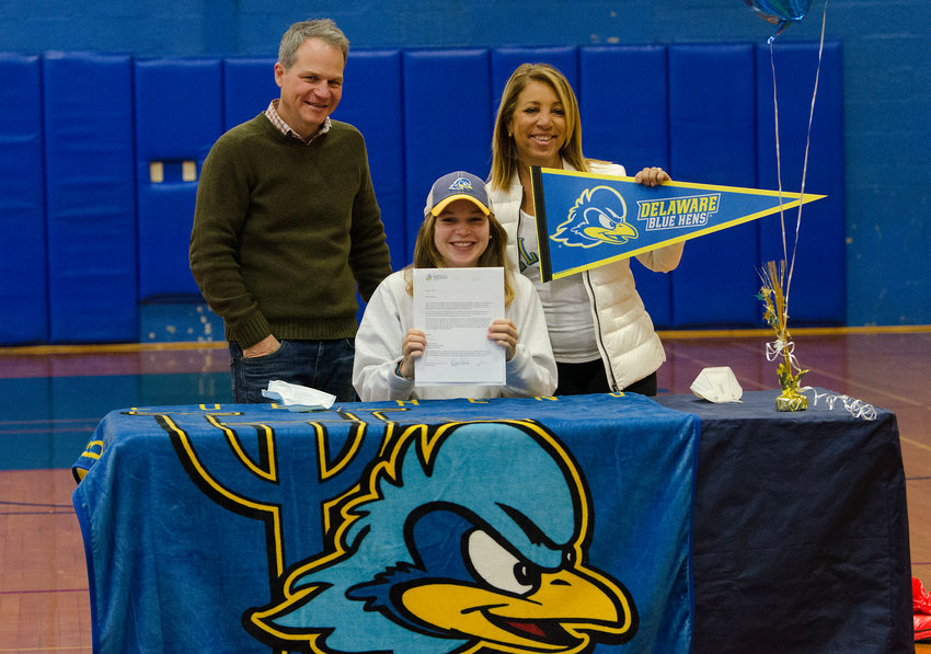 Barrington High School senior Mackenzie Stephens (center) poses for a photo with her parents, Mark and Suzette. Mackenzie recently signed a National Letter of Intent to compete at the University of Delaware next year.