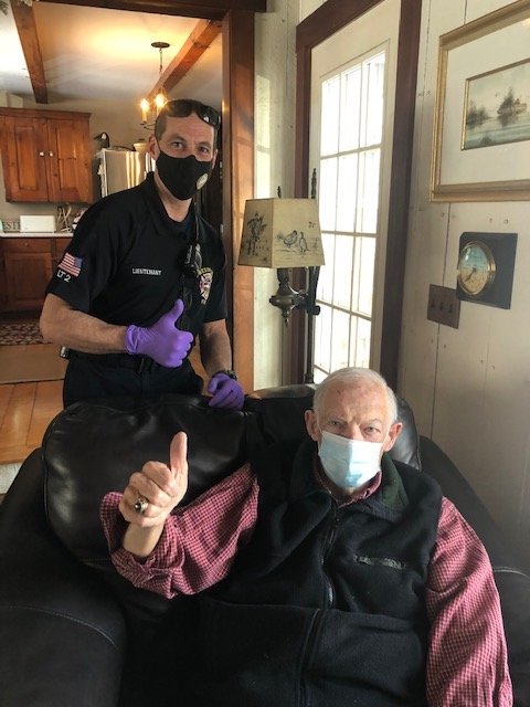Westport Fire Department Lt. Darren Nunes and town resident Robert McCarthy give a thumbs up after Mr. McCarthy received his homebound vaccine earlier this week.