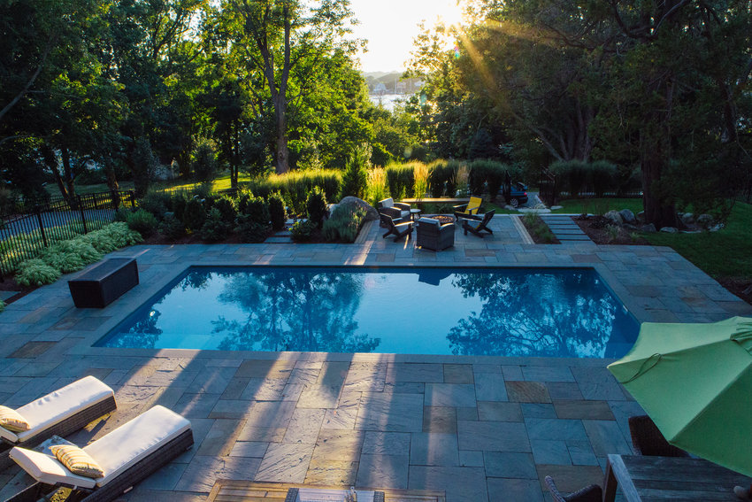 The plantings around the pool provide both privacy and a very soft, elegant atmosphere. Brooke said: &ldquo;There were so many big trees and beautiful plantings on the site, and there was woods behind it. The whole space was surrounded by natural areas, and the homeowner really liked that look, liked the natural stone on the property, so we wanted everything with did to blend with that natural setting &hellip; In a space like this you want to clean it up, but make it feel like it&rsquo;s always been there.&rdquo;