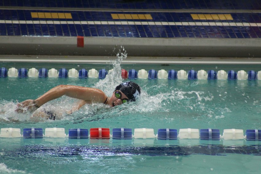 Emily Slusarczyk is shown competing in a sprint event at a recent swim meet.