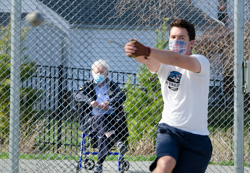 Longtime Barrington High School throwing coach Bob Gourley watches the Eagles&rsquo; Liam Capozza throw the hammer during a recent practice session.