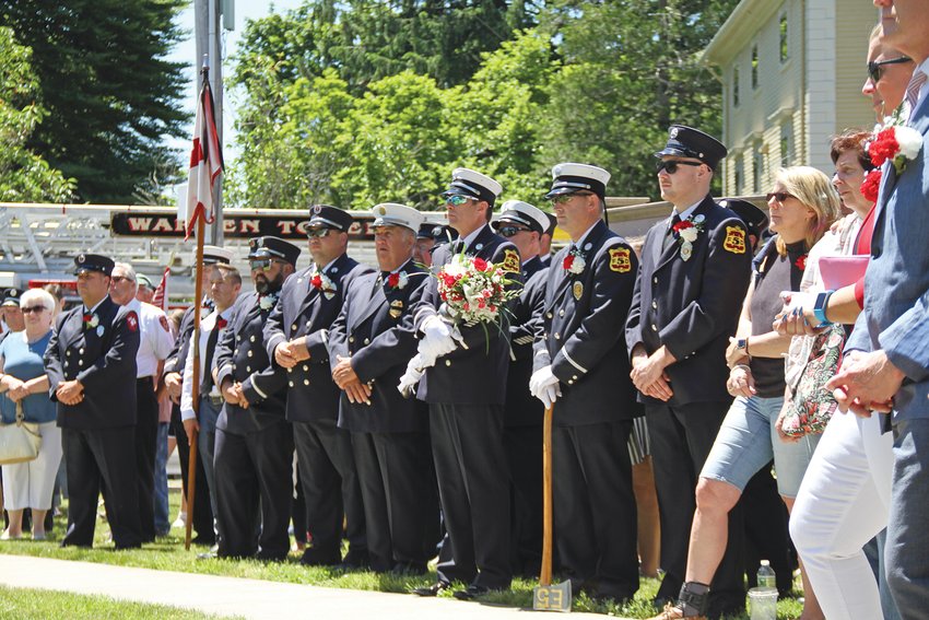 Firefighters line up at attention during the last public Firefighters' memorial ceremony held in Warren, in 2019.