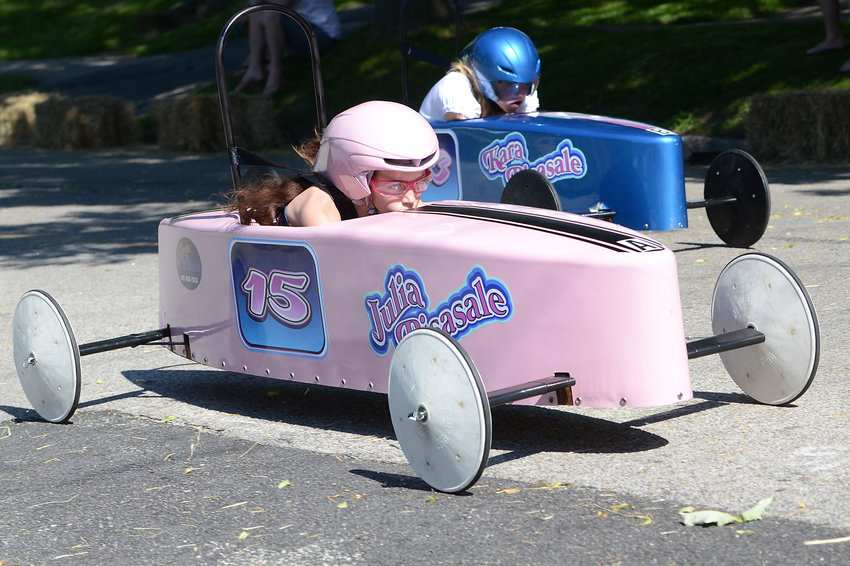 Champion Julia Pisasale, 10, races her big sister, Kara, 12, in the final race of the 71st Orange Crate Derby.