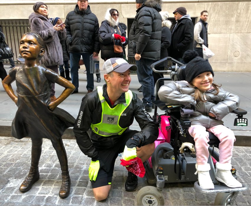 Jeremy Howard poses with Harper Oates, the inspiration for The Play Brigade, alongside the &lsquo;Fearless Girl&rsquo; statue in New York City. The statue originally faced the &ldquo;Bull of Wall Street statue and children often climbed up to pose for pictures with the girl. When Harper first visited she was unable to because of the raised plinth. Her mother was instrumental in advocating for the statue to be repositioned at ground level when it was later moved across the street from the NYSE. This picture was taken at the conclusion of the Fearless Girl relay that Ms. Oates organized.&nbsp;
