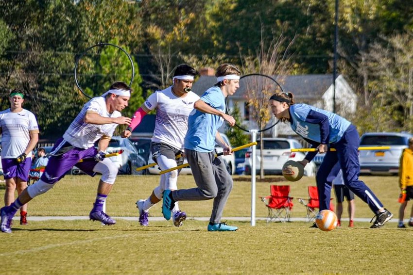 A John Hopkins University team competes in a recent game of quidditch, which is coming to Glen Park next month. Note the hooped goal posts in the background. (Photo courtesy of Ruthie Wood of Portsmouth, who plays for a John Hopkins team.)