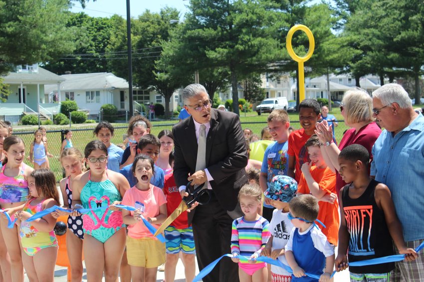 The community&rsquo;s youth, together with Mayor Bob DaSilva, Sen. Val Lawson and City Council Vice President Bob Rodericks, cut the ribbon on the new Pierce Field Splash Pad Monday, June 28.