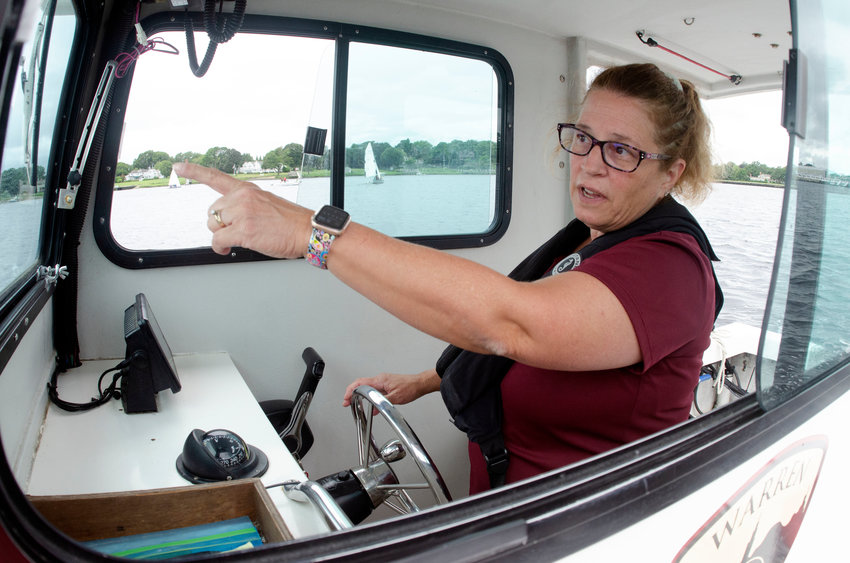 Assistant Warren Harbormaster Dawn Rego heads down the Warren River Monday afternoon.
