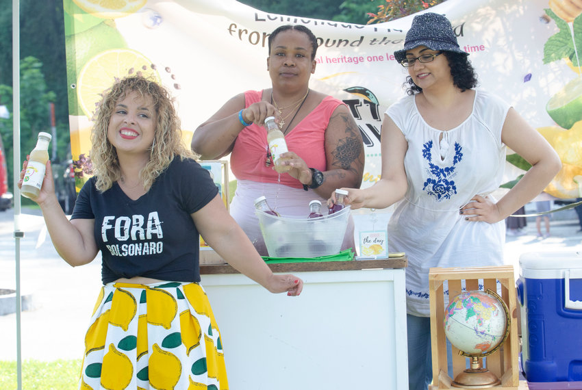 Organizer Mariana Silva-Buck enjoys a moment at the first of her &quot;block parties&quot; in Barrington last week.