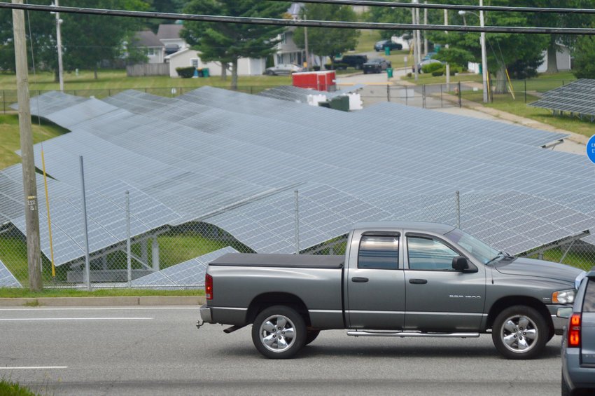 A section of the U.S. Navy&rsquo;s solar facility on West Main Road as it appears from the west end of Mill Lane. Many residents are worried that similar-looking, large-scale facilities will keep popping up around town. This development did not require town oversight, however, so it did not need to conform to minimum setbacks or buffers to appease abutters.