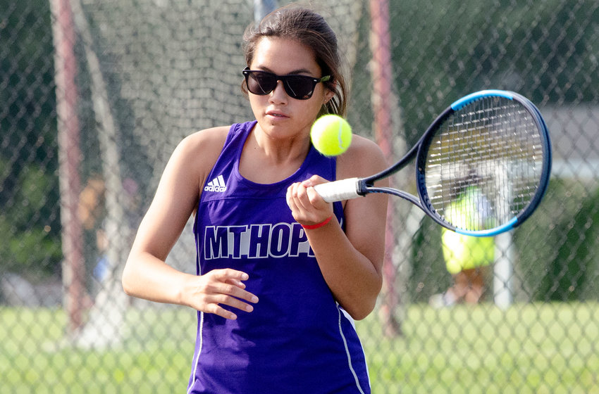 First singles player Elsa White hits a forehand during her match against South Kingstown on Wednesday.