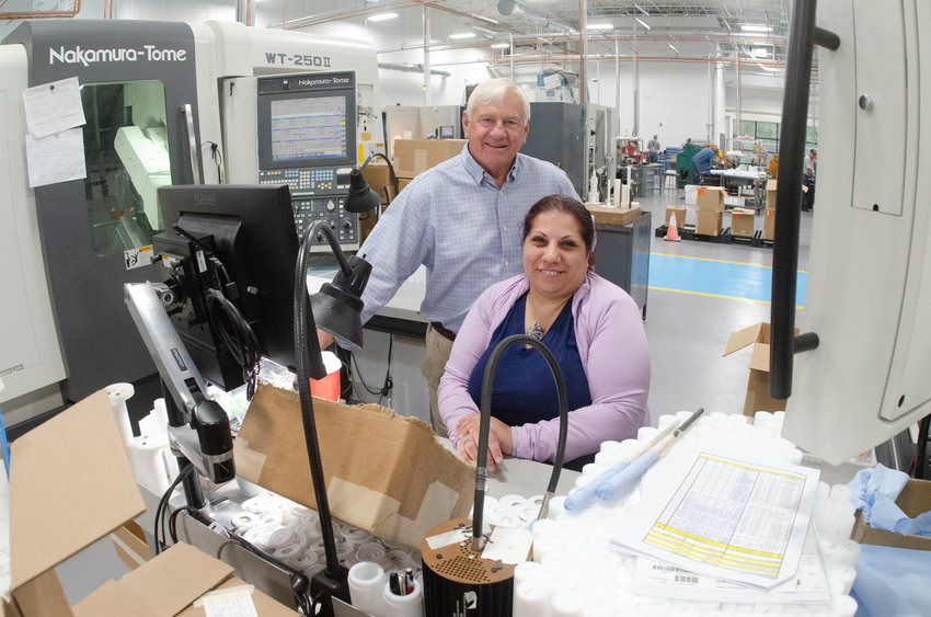 Part maker Sonia Borges, with Jade President Steve Holland, pose for a photo on the main floor.