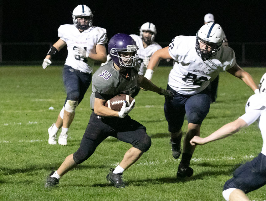 Running back Brock Pacheco runs for a first down in the second quarter of the team's home game against Westerly on Friday night. Pacheco ran for 23 yards and also had 23 receiving yards.