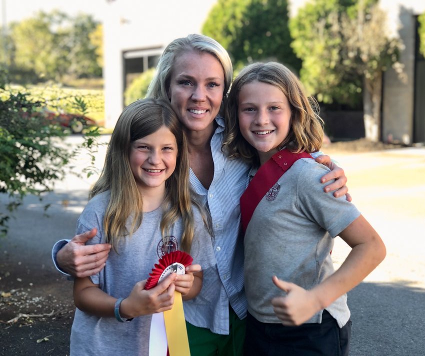 Avery Noel, who competed last week in the Grand National &amp; World Championship Morgan Horse Show in Oklahoma City, poses with her mother, Chelsea, and big brother, Mason. Avery and Mason held fund-raiders at Peak Fitness, where their mom works, to raise money for the competition.