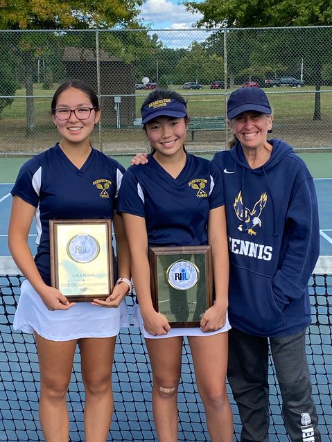 Barrington High School girls tennis coach Betsy Brenner (right) stands with the state championship doubles team of Ava Koczera-Kasem (left) and Katie Byon following the finals this weekend. Singles player Kate Robertson reached the semifinals of the state singles tournament.