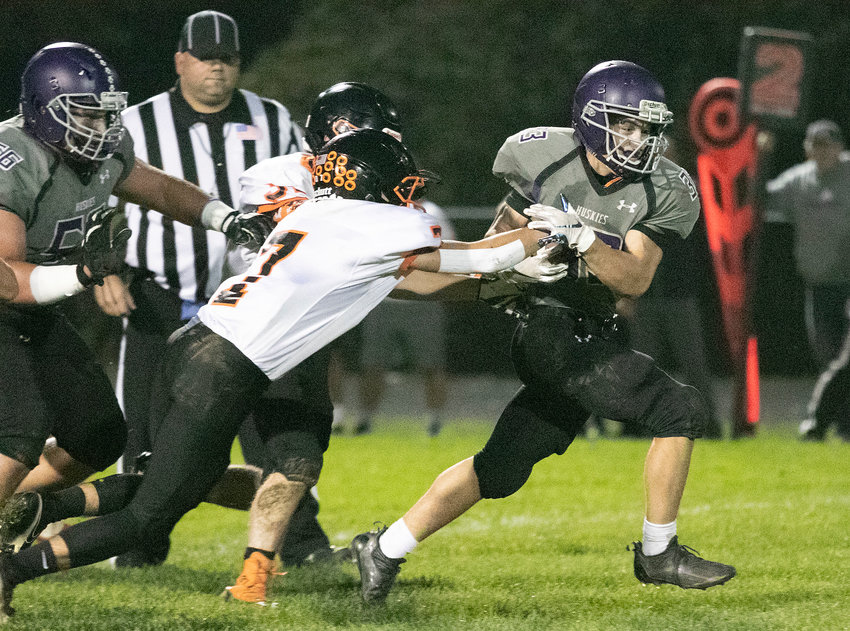 Brock Pacheco sheds a tackle for a big gain in the first half.