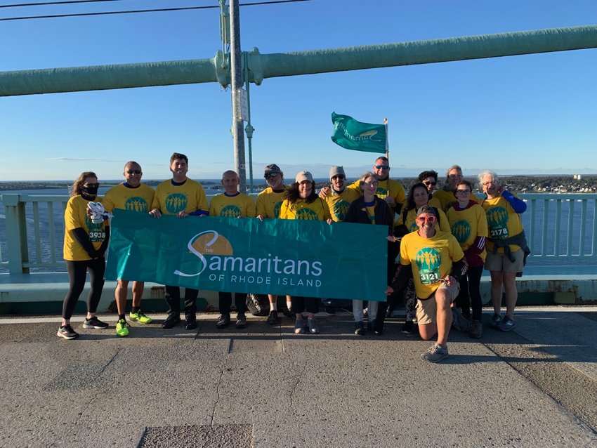 The Samaritans Team gathers for a photo on top of the bridge at the Pell Bridge Run, held Sunday, Oct. 17. The group includes barrier advocates Sen. Louis DiPalma and Rep. Joseph Solomon, as well as Melissa Cotta and Bryan Ganley of Bridging the Gap for Safety and Healing.