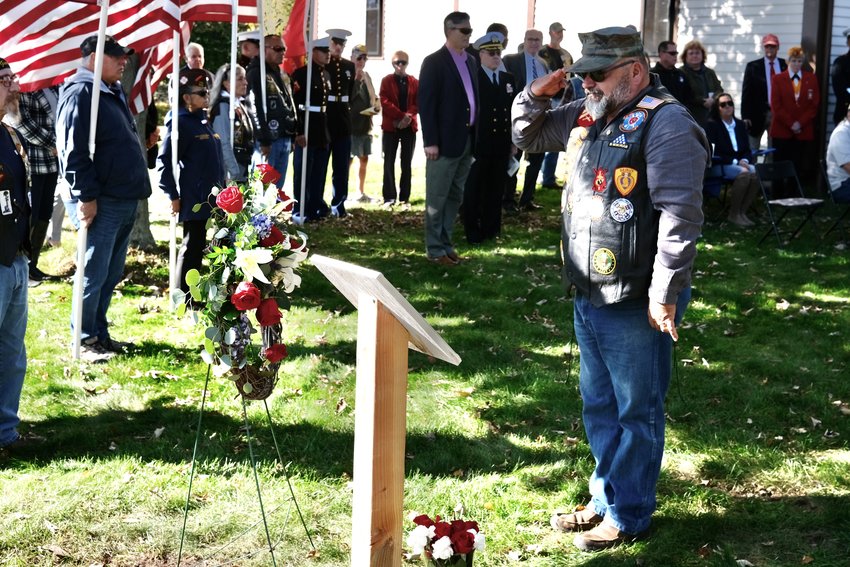 Russ Shipp salutes the memory of his brother, Corp. Thomas A. Shipp, after placing a rose to a wreath outside the Portsmouth Historical Society during the annual Beirut Memorial Service on Saturday. Corp. Shipp was among the nine Rhode Islanders killed in the Beirut terrorist bombing attack on Oct. 23, 1983.