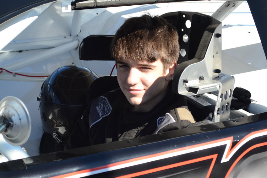 Jacob &ldquo;Rowdy&rdquo; Burns, a 15-year-old Warren native, sits inside of his late model race car in the pits at Seekonk Speedway after completing practice runs before the Haunted 100 race, where he placed 8th of 30 racers.