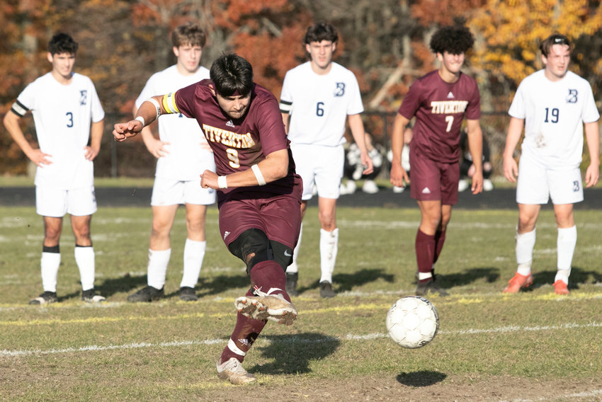 Tigers senior captain Luke DelDeo blasts a penalty kick by Broncos goalkeeper Brady Linfield to give the Tigers a, 3-2, lead with three minutes left in the game. Tiverton went on to win and will play in the Division III championship on Sunday.