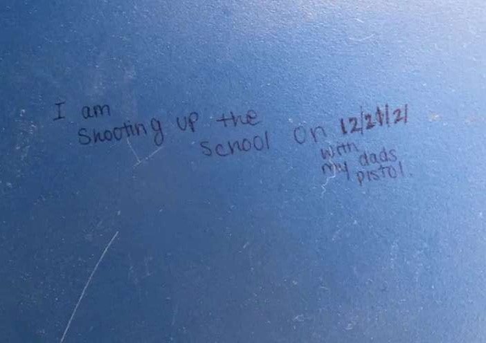 This image of a message written inside a girls' bathroom at Barrington High School on Monday, Dec. 13, was being circulated among students at the school.
