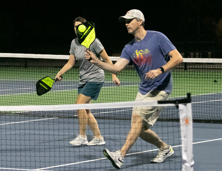Residents play a game of pickle ball on Barrington Middle School tennis courts.