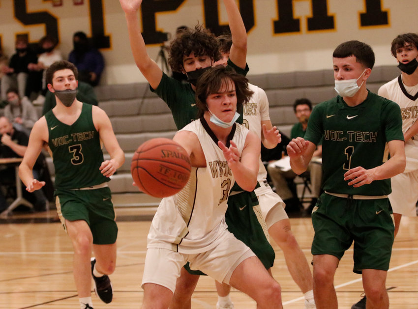 Cam Leary makes a pass as the Wildcats get into their offense during a non-league home game against Great New Bedford on Wednesday. Leary, Jayden Zuber and Ben Poitras came off the bench and combined for 18 points for the Wildcats in a 62-53 victory.