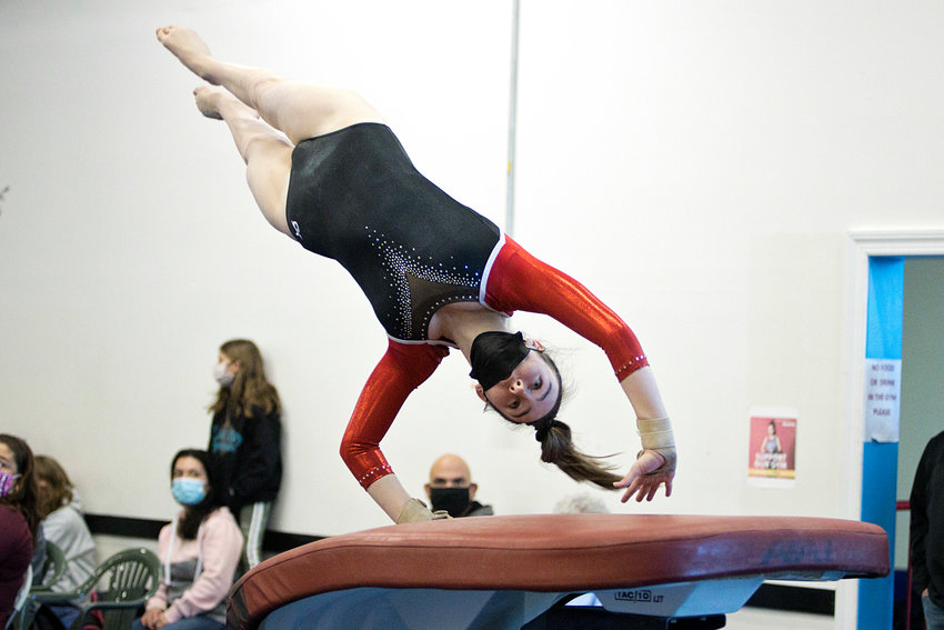 Hailey Kaiser competes on vault during the Saturday, Jan. 22, meet against Portsmouth, Middletown, and Mt. Hope.