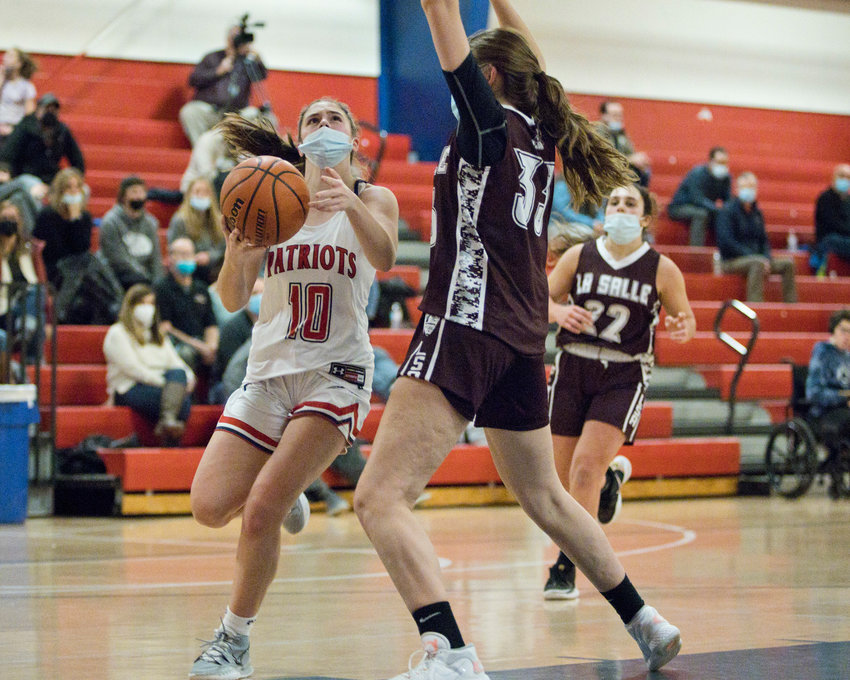 Portsmouth High&rsquo;s Kaitlin Roche goes in for a layup late in the second half of Friday's game against La Salle. She led the Patriots&rsquo; offense with 12 points.