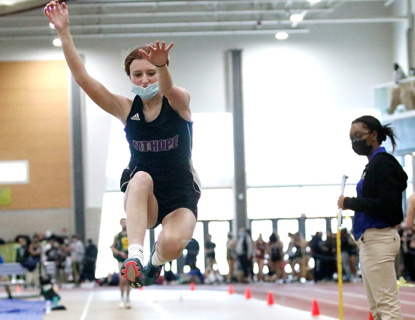 Freshman Lola Silva took home the gold medal in the long jump with a leap of 16 feet 2.5 inches during the freshman state track championships at the Providence Career and Technical Academy on Monday night. In photo, Silva makes her second place leap during the class championships on Saturday.