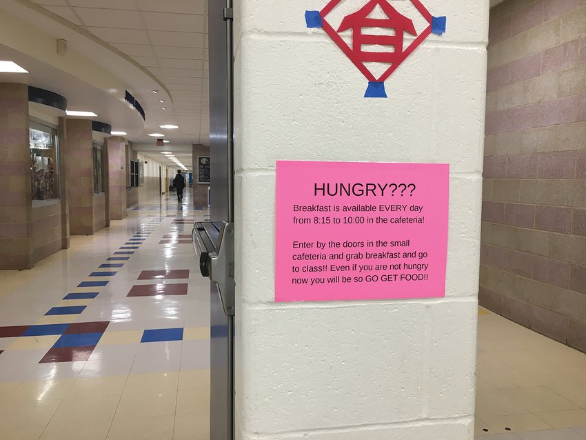Four of these hot pink signs were posted in the front foyer of Barrington High School last week. Orange signs with the same message were posted near another entrance. No one at the school was able to answer who posted the signs or when.