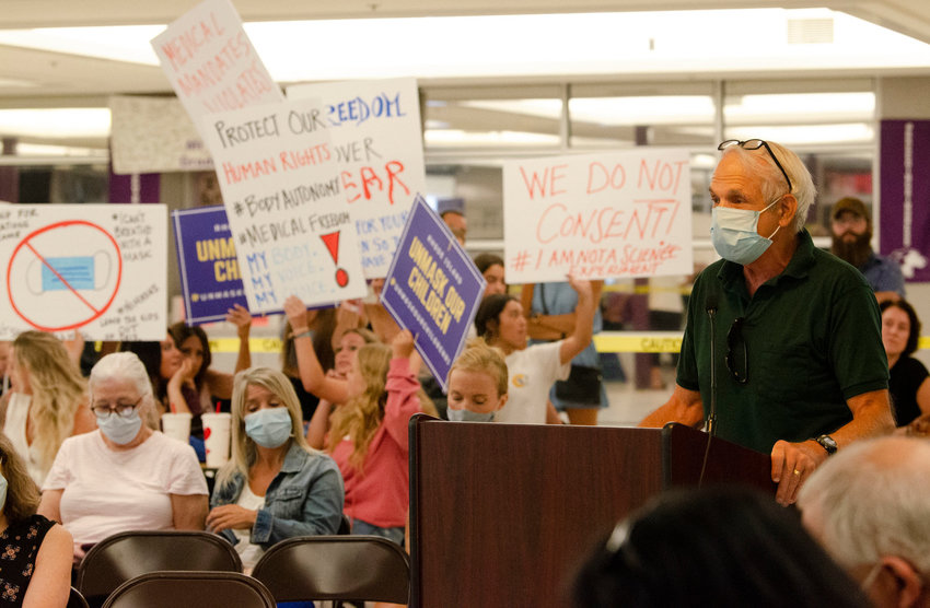 A crowd of anti-mask protesters filled up the Mt. Hope High School cafeteria in August while the Bristol Warren Regional School Committee debated whether to adhere to the governor's mask mandate at the start of the 2021-22 school year. Dr. Geoffrey Berg, a masking proponent, is at the podium.