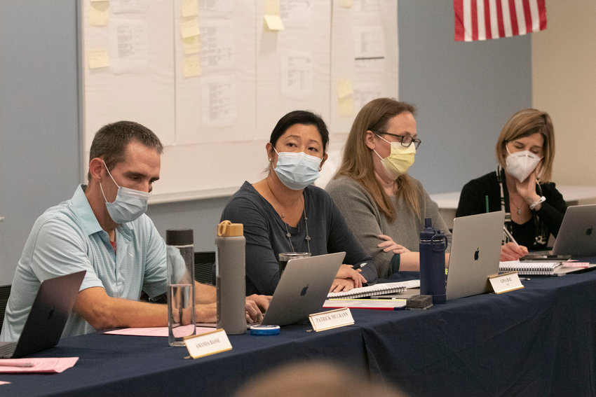 Shown during a meeting late last year are school committee members Patrick McCrann, Gina Bae, Megan Douglas and Erika Sevetson (from left to right).