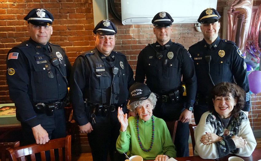 As one of the oldest living residents in the East Bay area, Genevieve Marszalek has seen it all and done it all in her 108 years on this planet. Here she sports a Bristol PD cap while posing with members of the Bristol Police Department during her celebration.