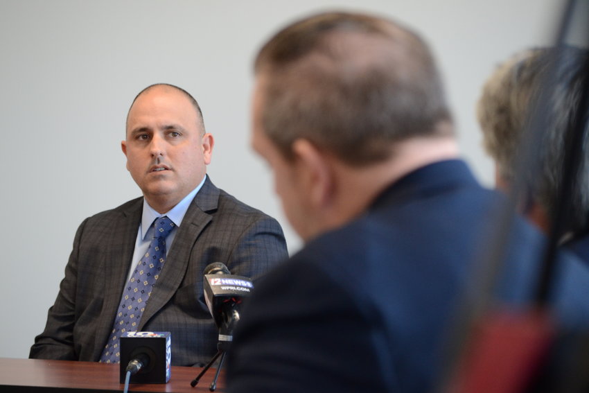 Lt. Christopher Perreault of the Warren Police Department answers questions from Town Solicitor Tony DeSisto on Thursday morning at the Department of Administration in Providence.
