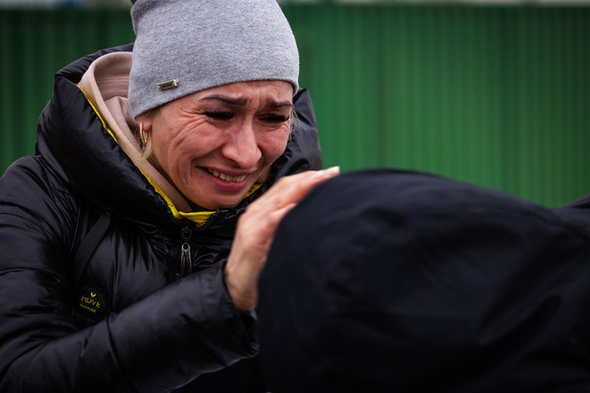 A Ukrainian woman is overcome with grief as she makes her way into Poland earlier this month.