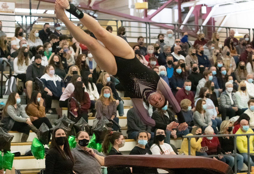 Reese Pavao performs on the vault, where she scored a 9.15 during the state gymnastics meet at Rhode Island College on Feb. 20.