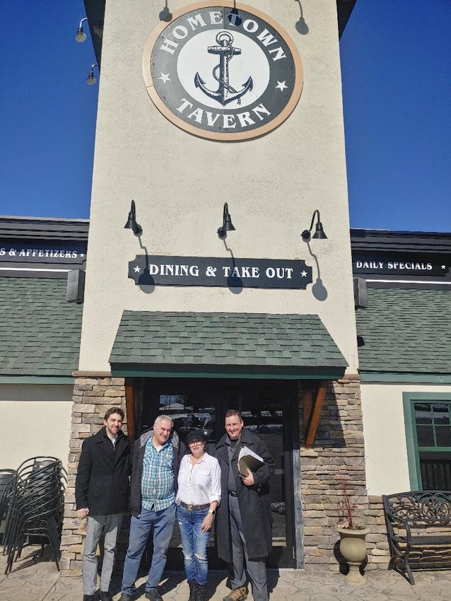 Former Hometown Tavern owners Jon and Rose Tagessian are flanked by their realtors, Robert Rox (left) and Michael Alves, of KW Elite Commercial Realty.