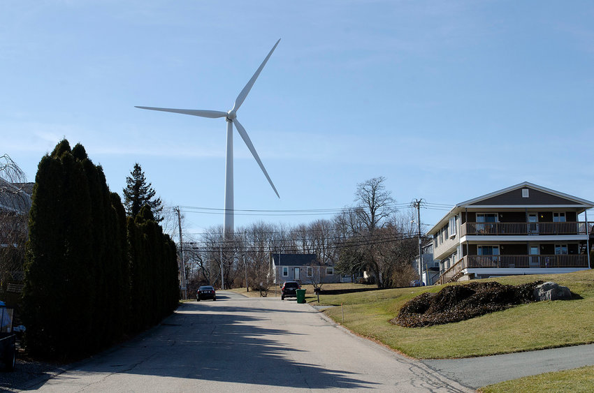 A view of the Portsmouth wind turbine from Butts Street, off Sprague Street. Activated in August 2016, the turbine replaced one that broke down in 2012. Some neighbors, several of which recently lost their case in Superior Court, say they&rsquo;re still experiencing excessive noise and shadow flicker generated by the new machine. (File photo)