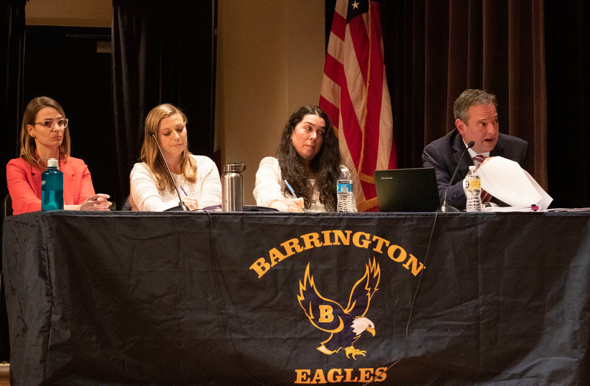 Attorney Greg Piccirilli (right) sits with his clients Stephanie Hines, Brittany DiOrio and Kerri Thurber (from left to right) during a previous hearing at the high school.