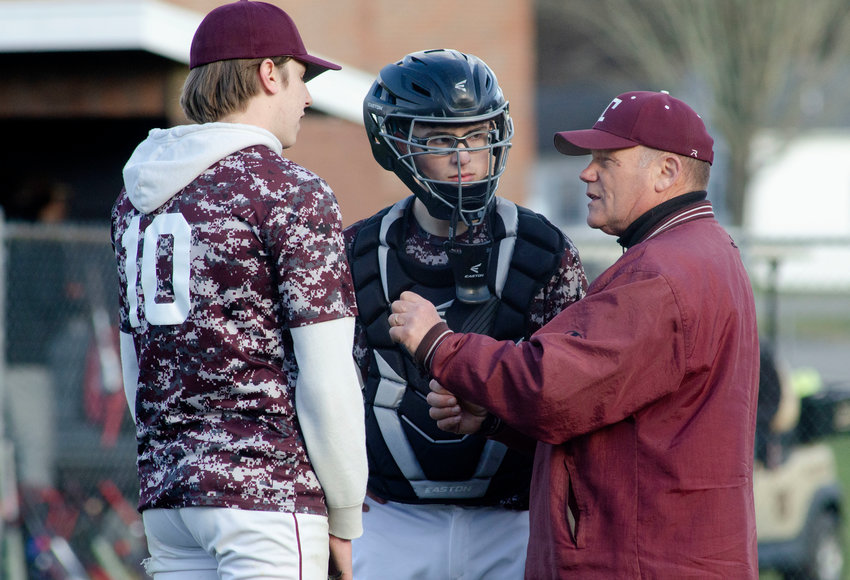 Tiverton head coach Bob Murray speaks to battery mates Devin Pieroni and Jordan Panell during the Tigers&rsquo; scrimmage game at Westport on Wednesday. Murray is retiring from teaching and coaching after the season.