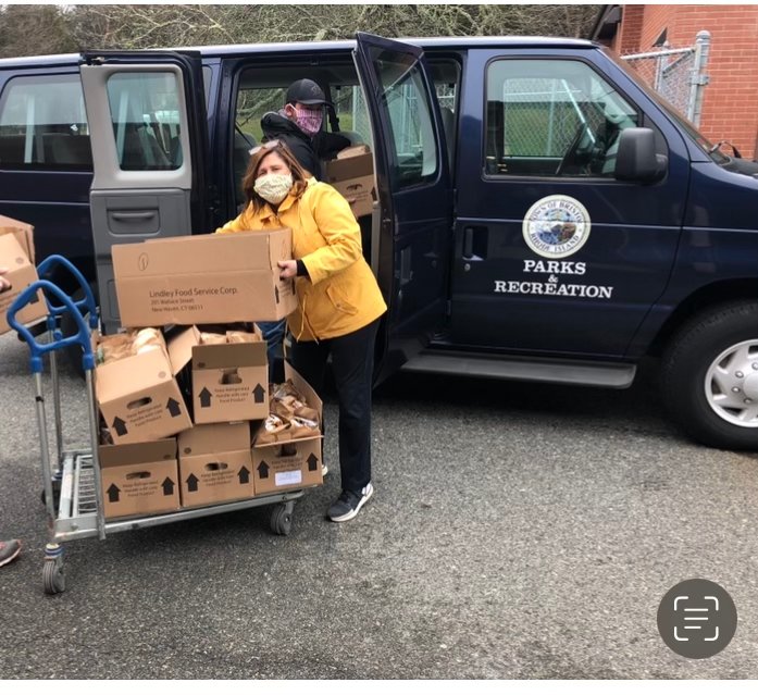 Sarah Klein, director of the Bristol Parks and Recreation Department, helps deliver food to homebound individuals during the Covid-19 lockdowns.