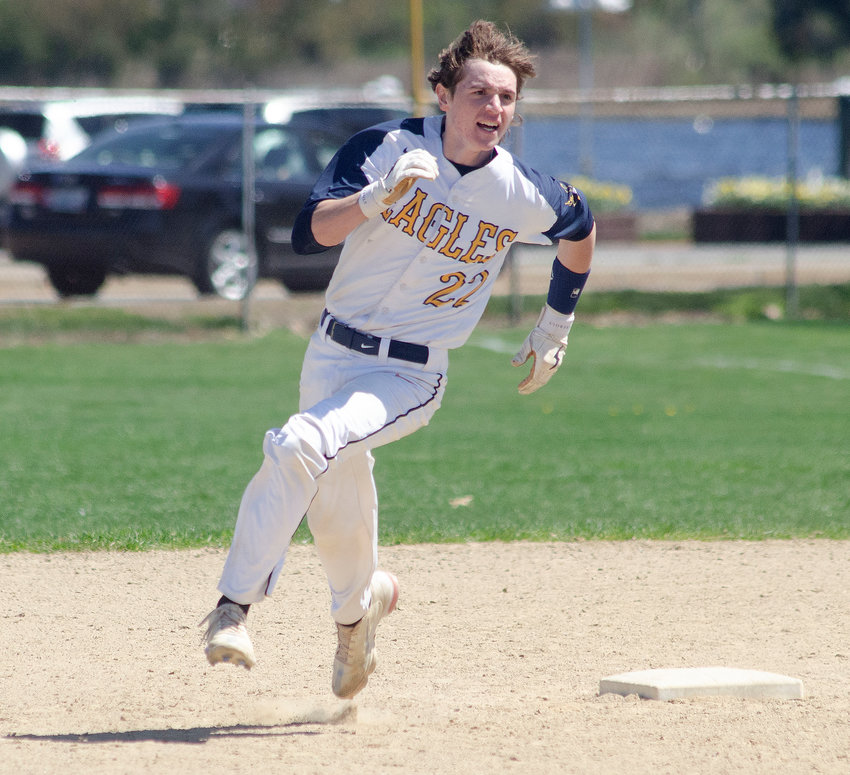 Drew Lapointe sprints around second base en route to his first of two triples during the Eagles' win on Friday.