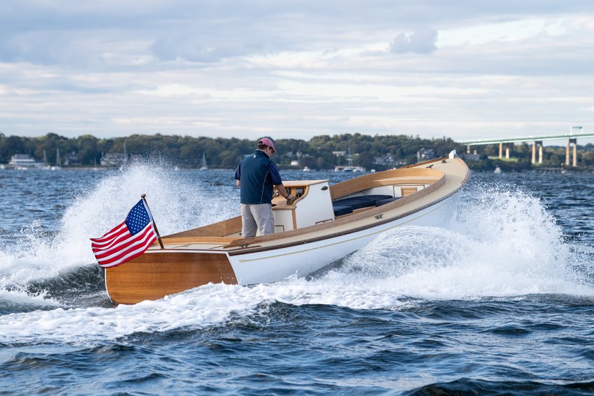 East Passage Boatwrights&rsquo; founder Carter Richardson steers the East Passage 24, Classic Boat magazine&rsquo;s Best New Powered Vessel of the Year in (where else?) the East Passage of Narragansett Bay.