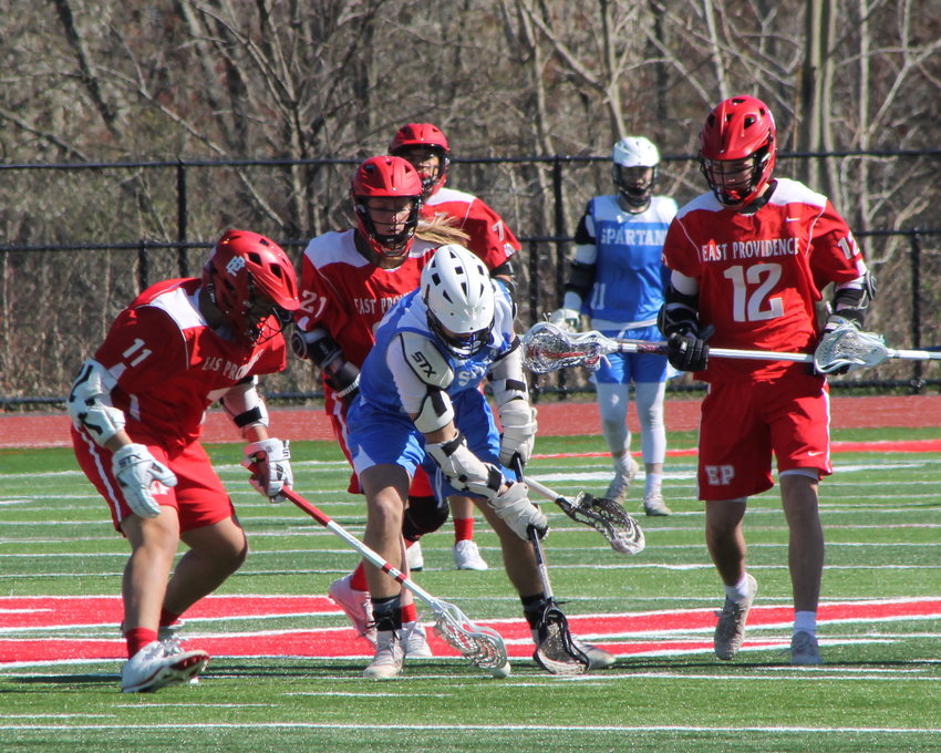 East Providence High School&rsquo;s Kael Conaty, Riley Feeney and Ryan Travassos (from left to right) vie for possession against an opponent from Scituate during the recent Division IV boys&rsquo; lacrosse outing between the teams on Thursday, April 21. The visiting Spartans defeated the Townies by a 7-5 score.