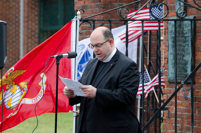Father Angelo Caruso shares a benediction during the Barrington UVC-organized Memorial Day event at Victory Gate last year. The BUVC will again hold a Memorial Day ceremony at Victory Gate this year.