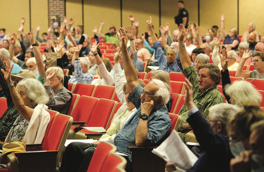 Voters give a near-unanimous show of support for the funding of an assistant town planner position at last year's Town Meeting.