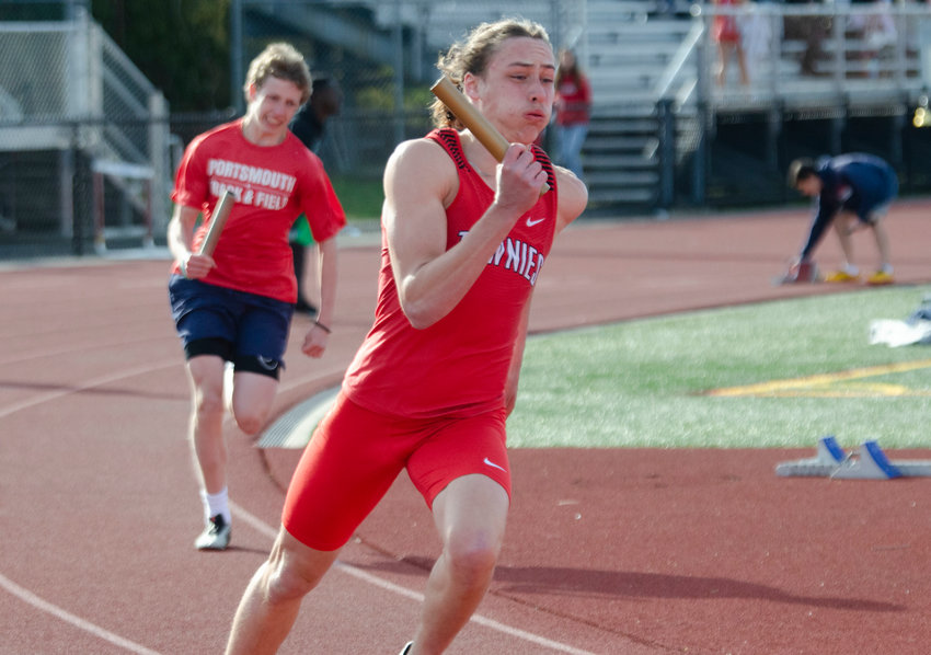 East Providence's Nick Morrison runs a leg of the 4x100 relay for the Townies in a recent regular season outdoor track meet.