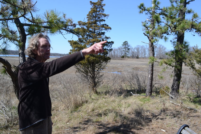 Rock Singewald, President of the Warren Land Conservation Trust Board of Directors, points to areas of Haile Farm Preserve during a walk through the public trails in April.